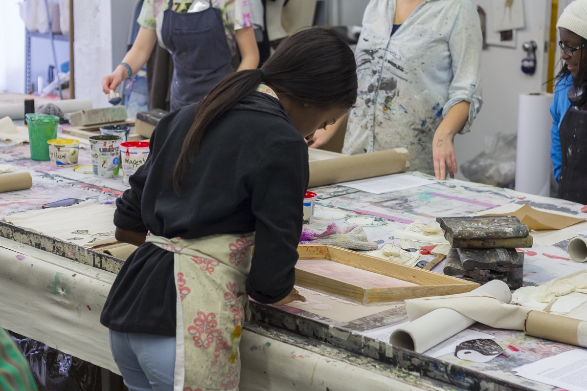 young lady silk screening